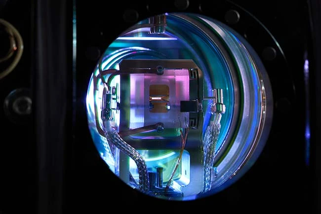 Ion trap installed in a vacuum chamber acts as the quantum processor Ion trap installed in a vacuum chamber acts as the quantum processor