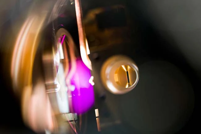 Ion trap installed in a vacuum chamber acts as the quantum processor Ion trap installed in a vacuum chamber acts as the quantum processor